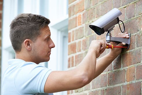 engineer installing cctv camera
