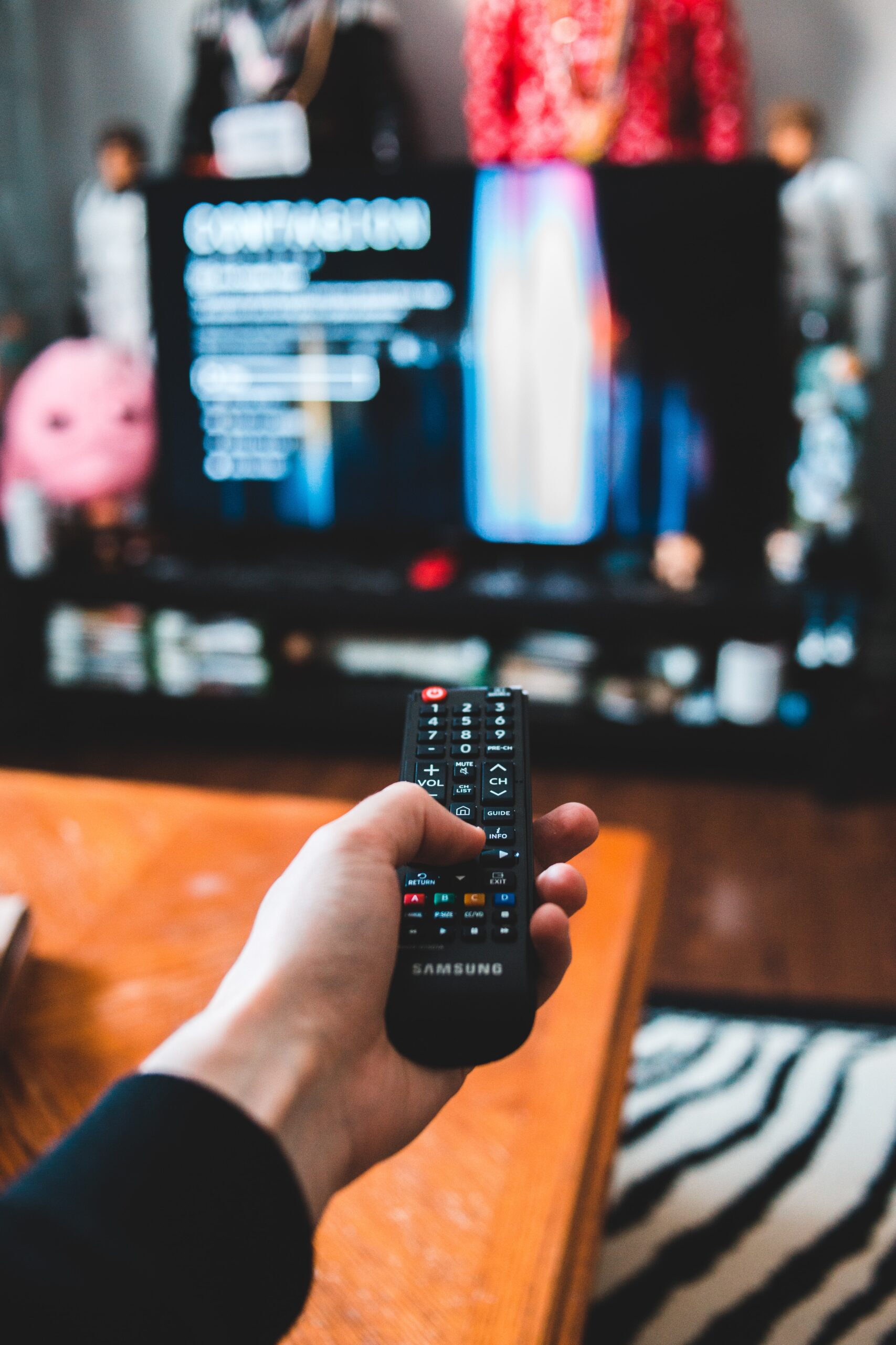 An image of a remote being pointed at a TV