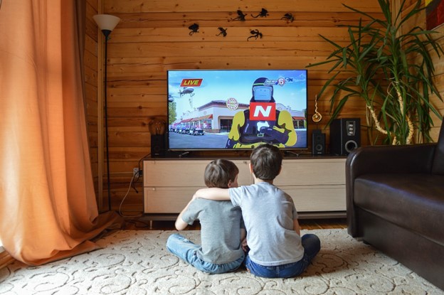 Boys watching tv in a loft