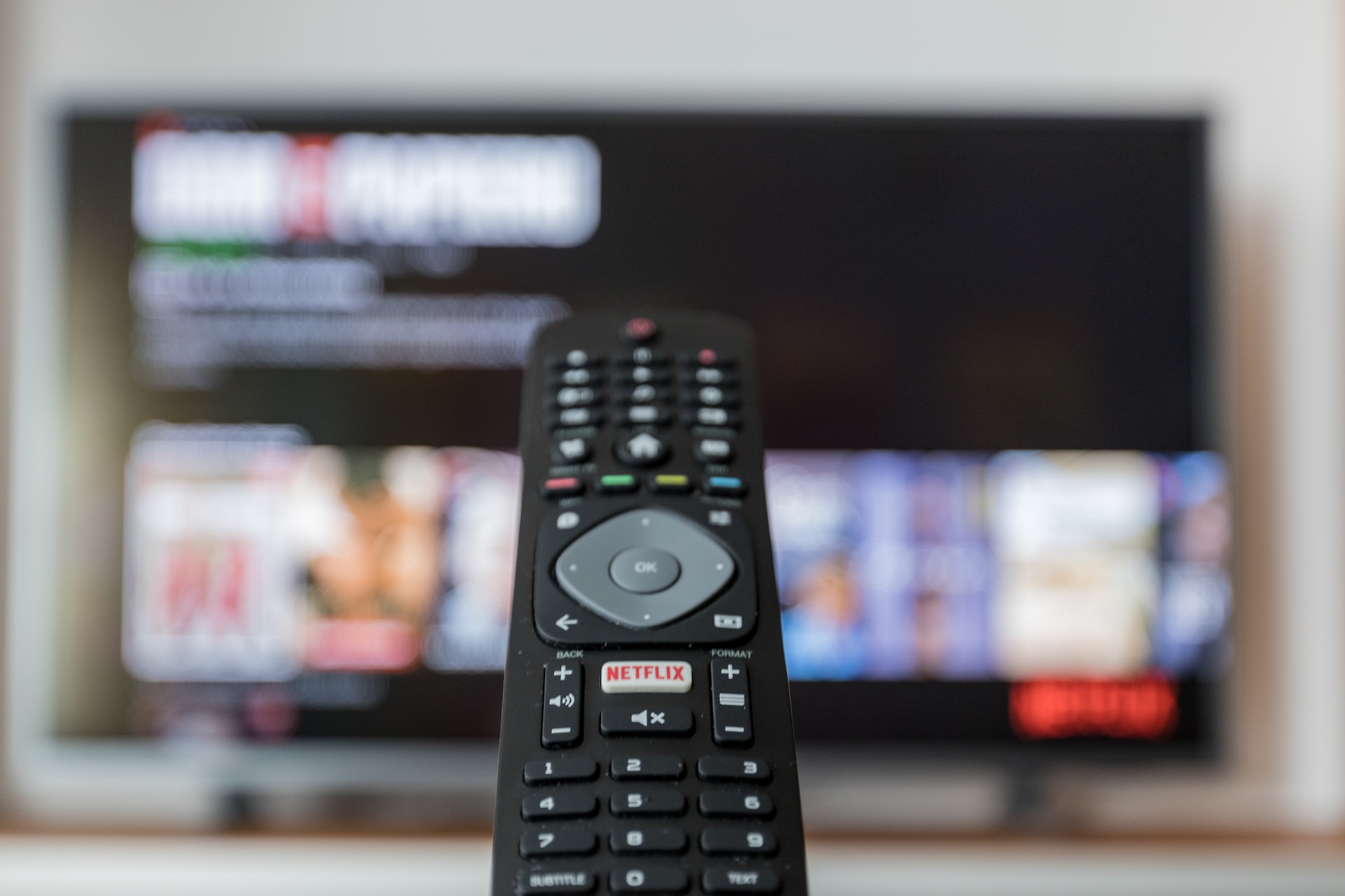 A remote being pointed at a TV